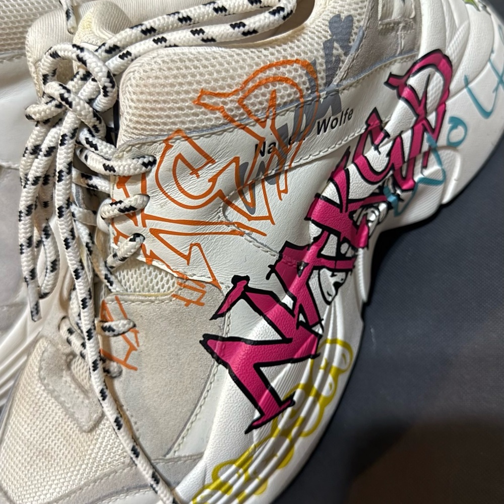 Naked Wolfe Cream Sneakers with Bold Graffiti